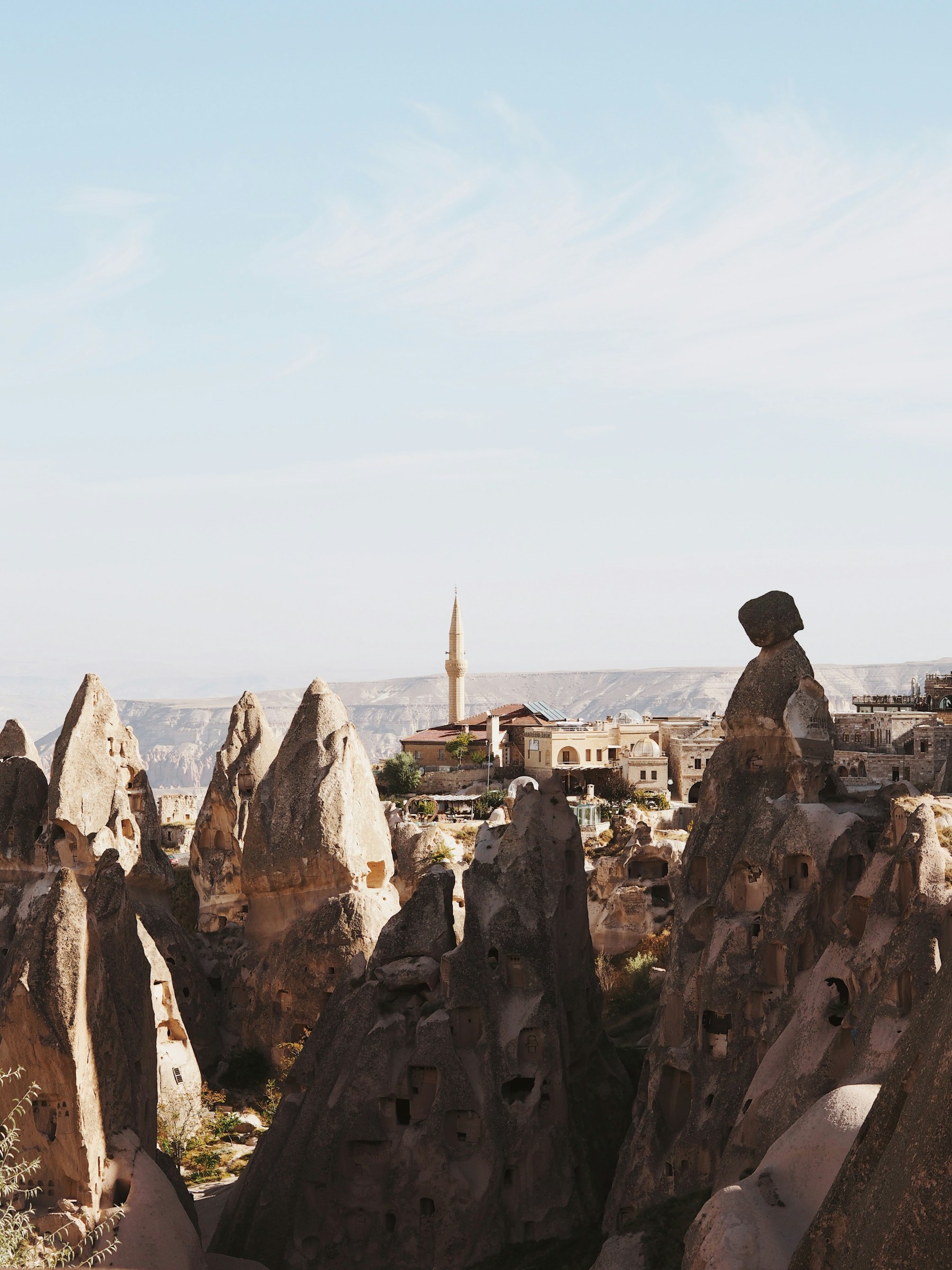 Rock formations and a village in Cappadocia