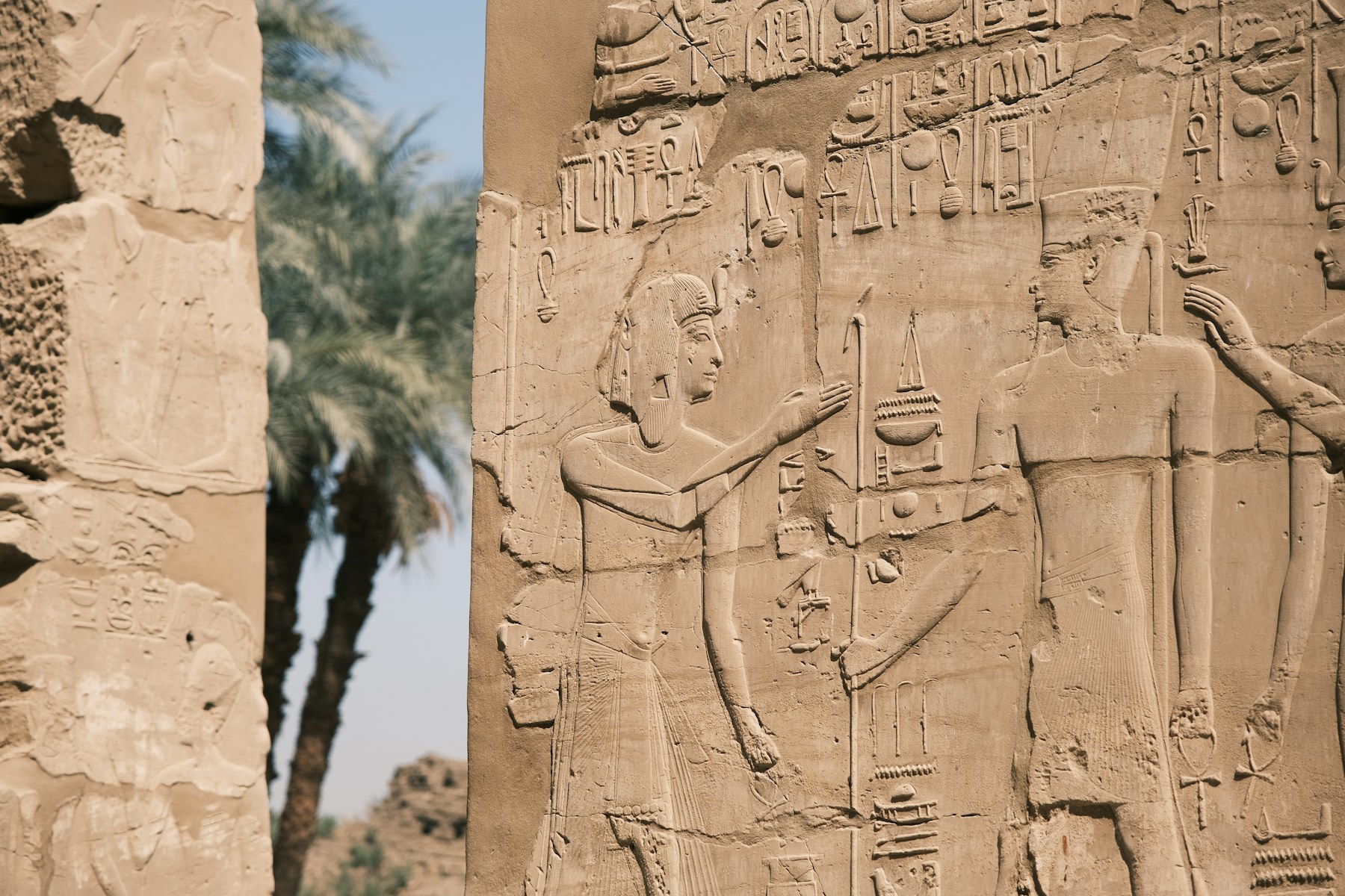 Carved figures and inscriptions on a Karnak wall